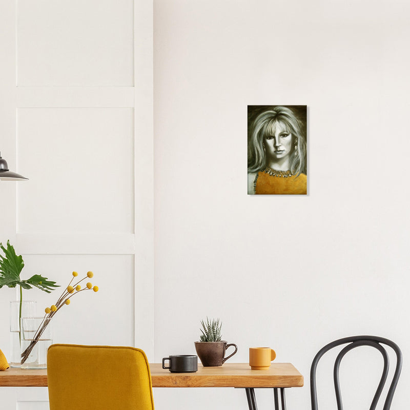 Modern dining room with wooden table, yellow chair, succulent, mugs, wall art portrait of woman