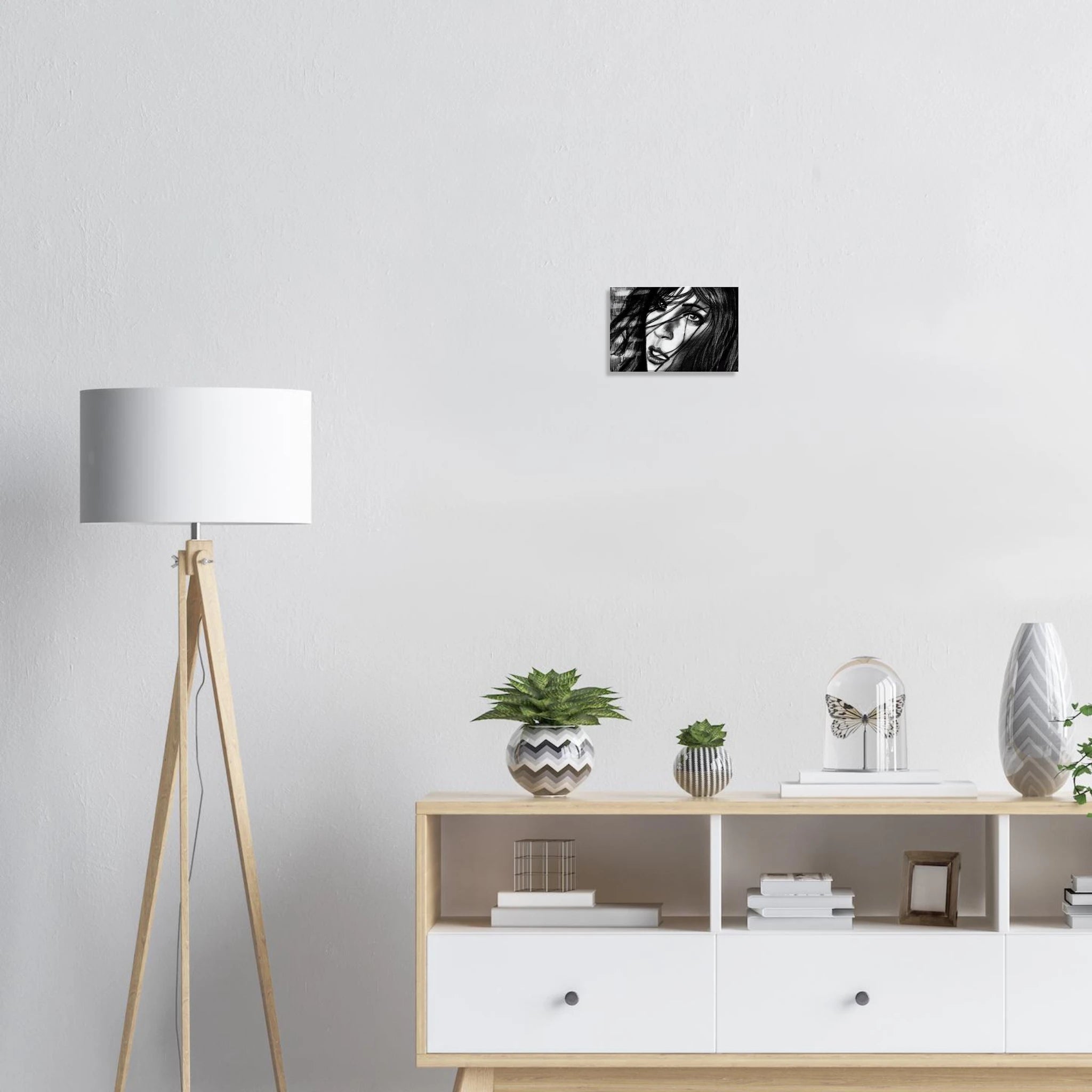 Minimalist living room with wooden floor lamp, modern sideboard, potted plants, butterfly decor, and black-and-white portrait wall art