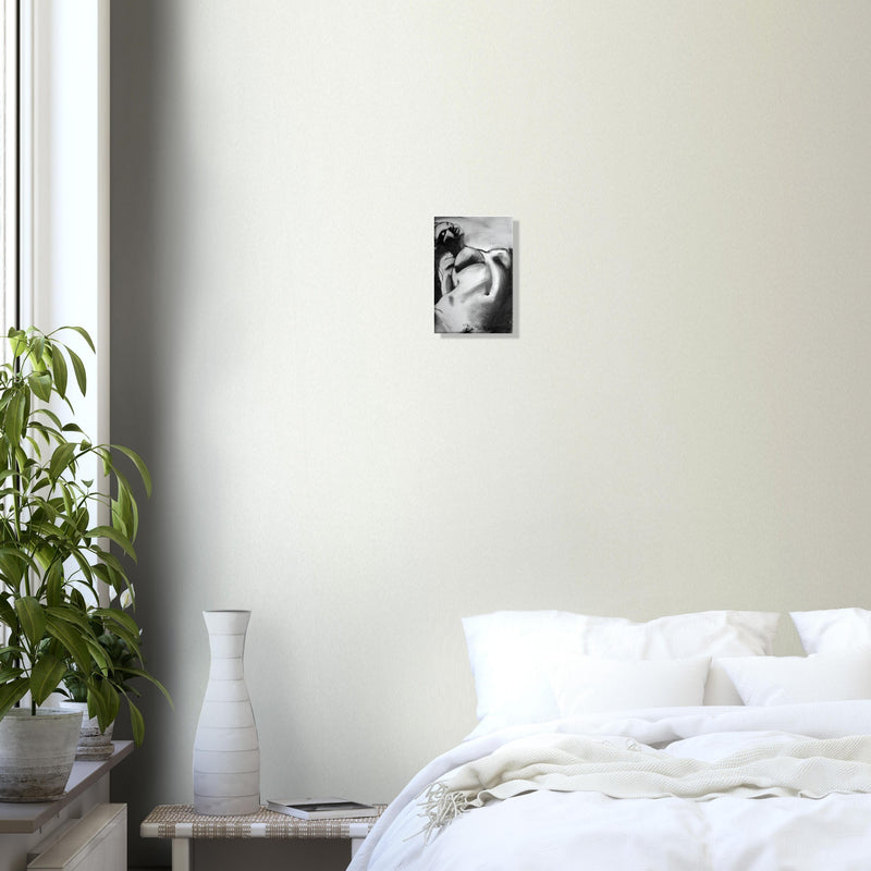 Modern bedroom with white bedding, indoor plants, and black-and-white portrait art on beige wall