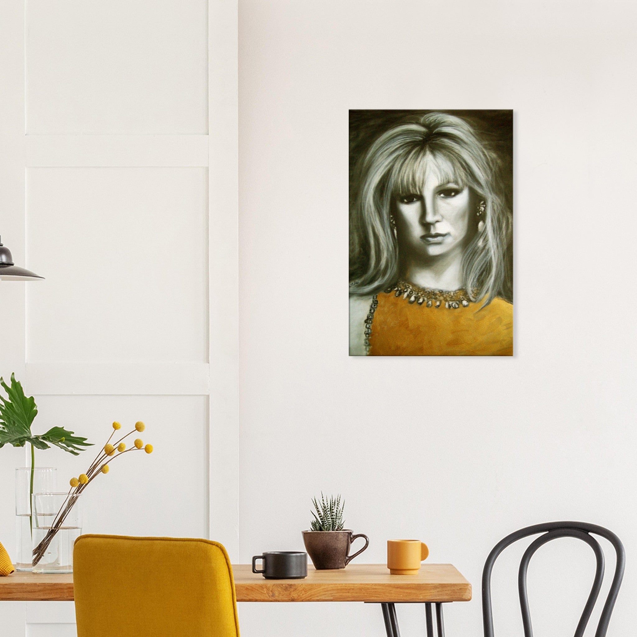 Modern dining room with wooden table, yellow chair, potted plants, and framed portrait of a woman in yellow dress