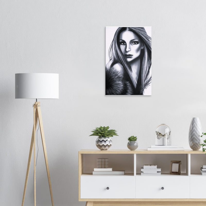 Modern living room with black and white female portrait artwork, wooden tripod lamp, and minimalist shelf decor
