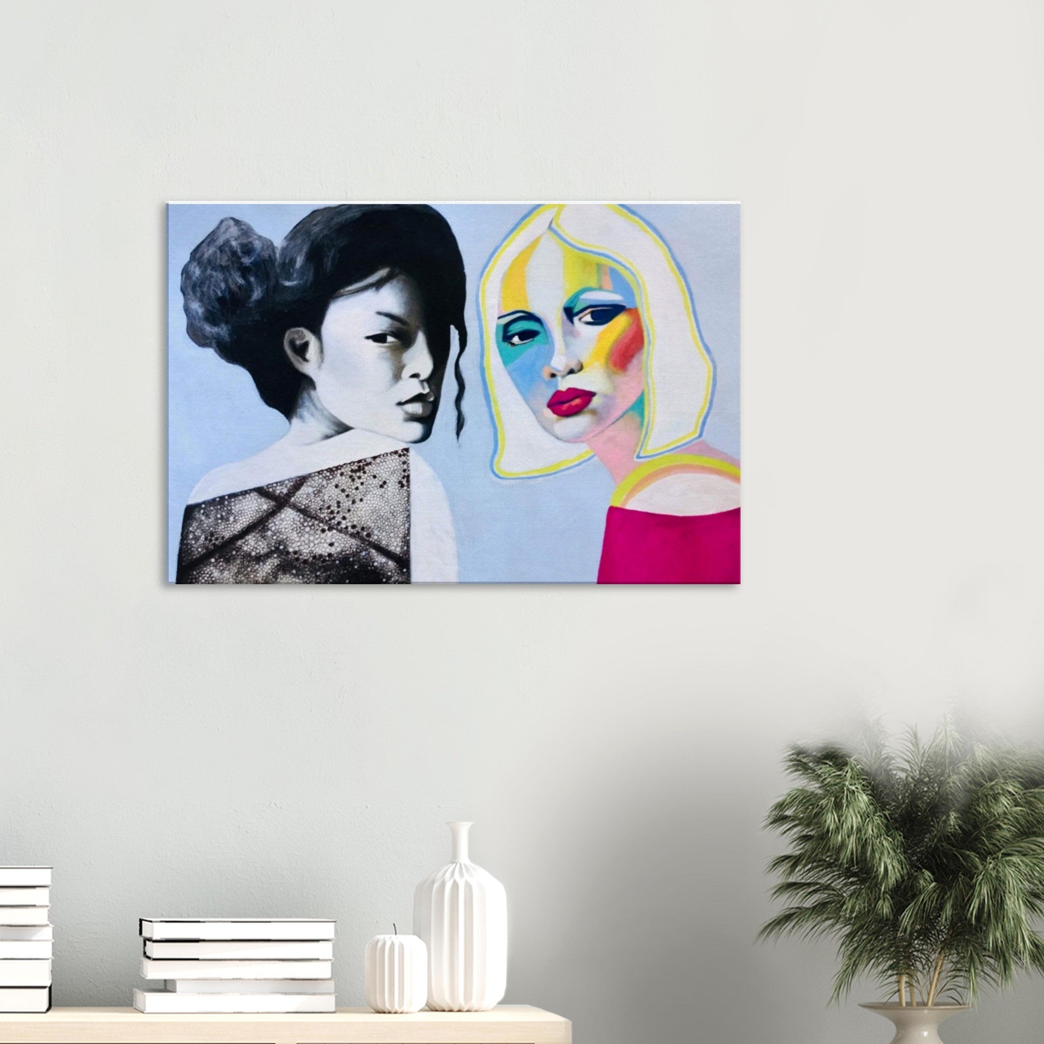 Modern wall art painting of two women, one in grayscale and the other in vibrant colors, displayed in a minimalist room