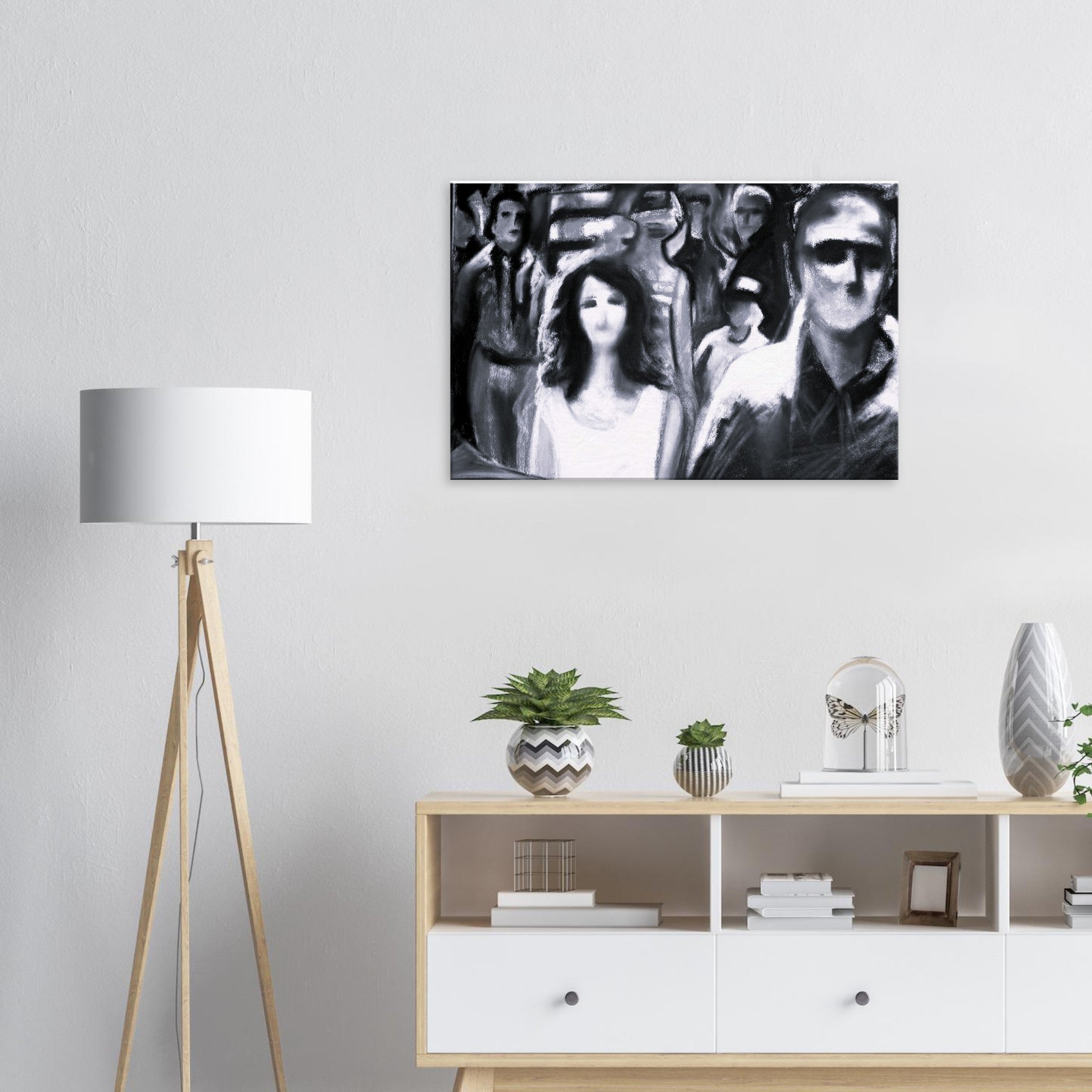 Modern living room with black and white abstract human figures painting, wooden floor lamp, and decorative plants