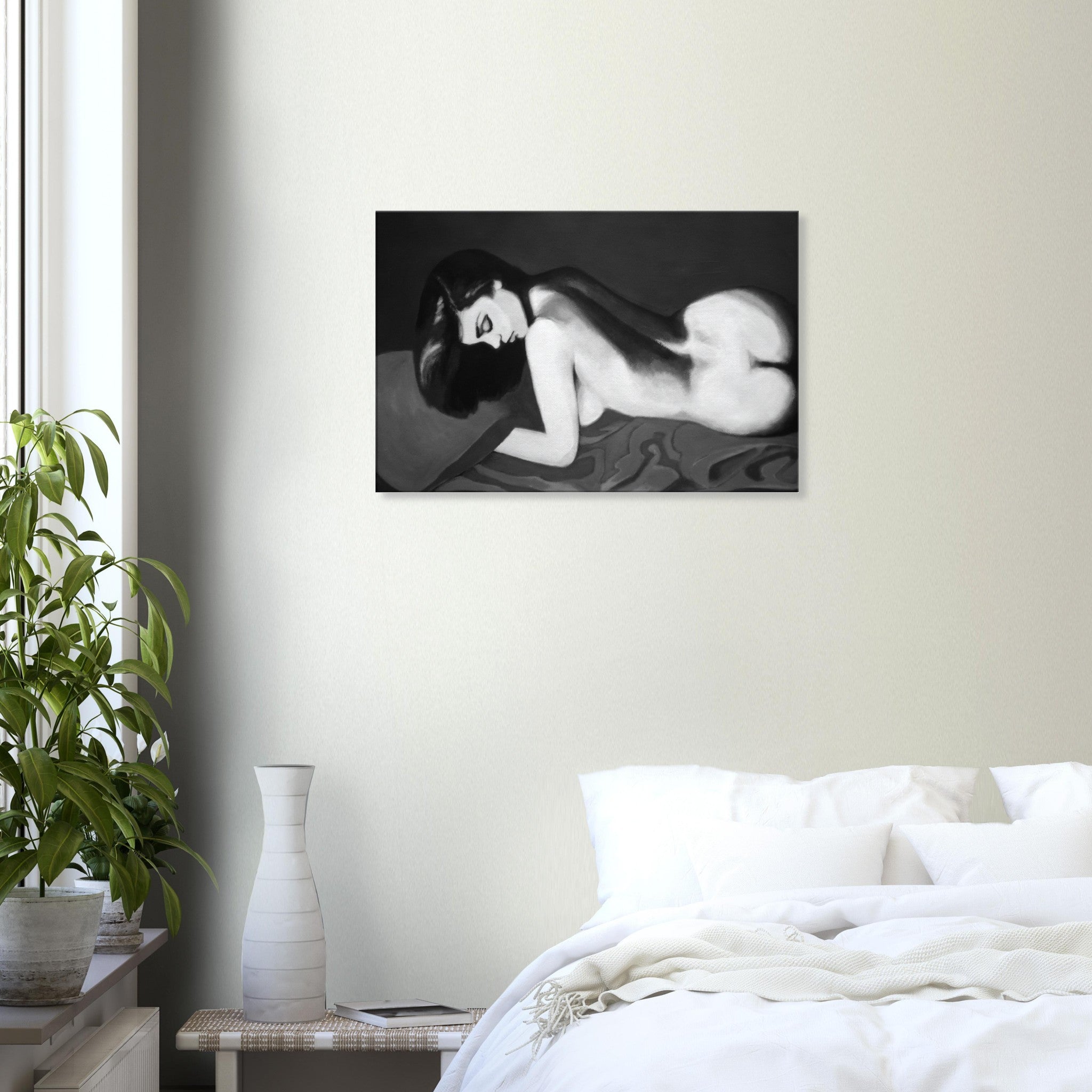 Black and white painting of a nude woman lying on her side displayed in a modern bedroom