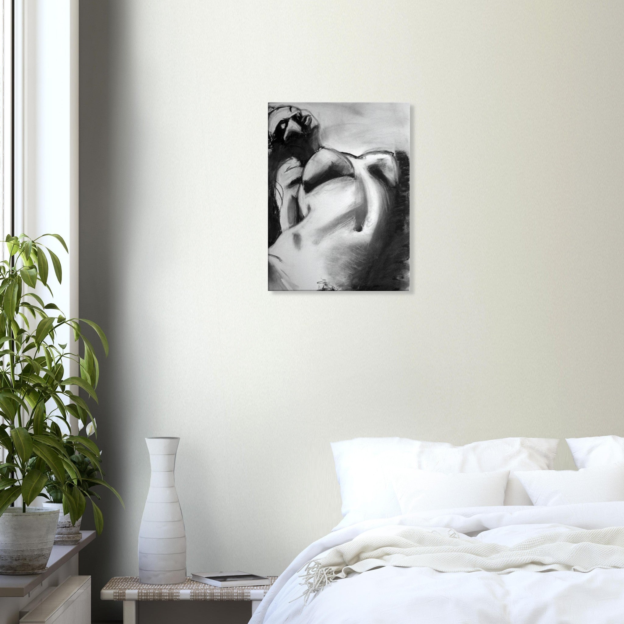 Black and white abstract painting of a reclining nude woman on bedroom wall above bed with white linens