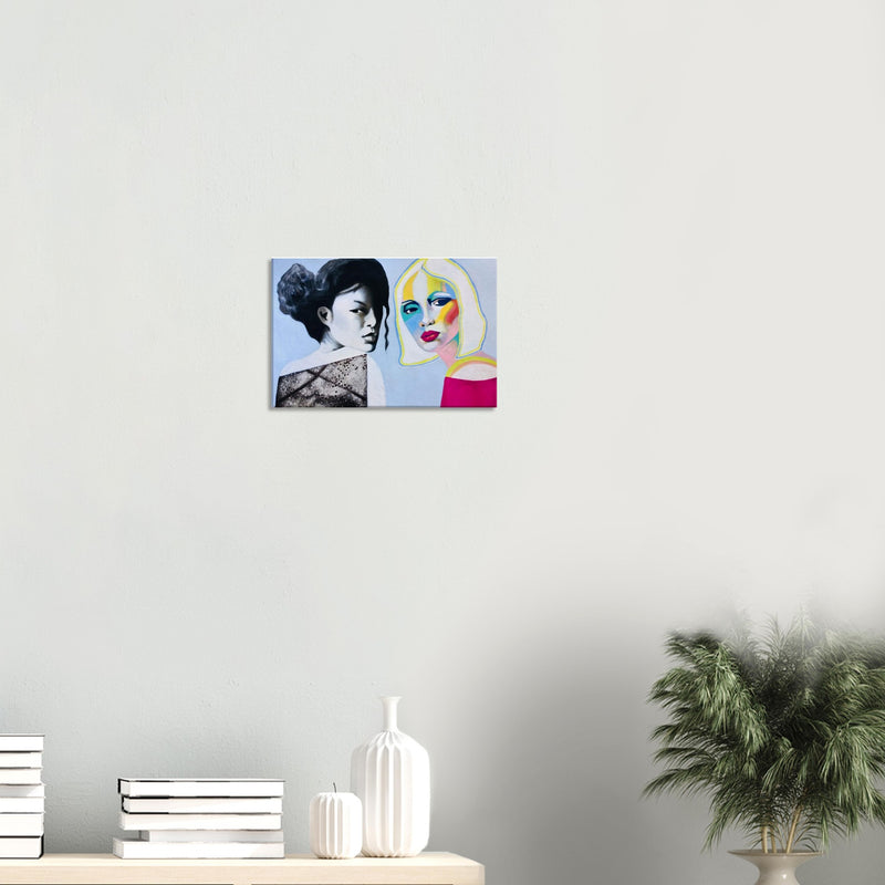 Modern painting of two women, one monochrome in black dress, the other colorful with blonde hair, on white wall