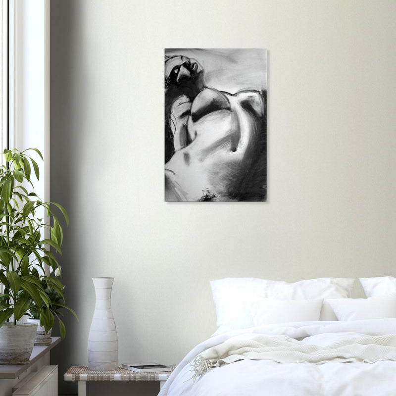 Black and white abstract painting of a reclining nude woman hanging above bed in minimalist bedroom
